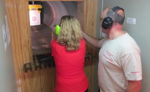 Instructor providing fundamentals of handgun training